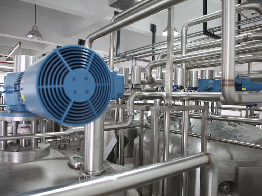 Stainless steel piping and pump skid at a well service treatment facility